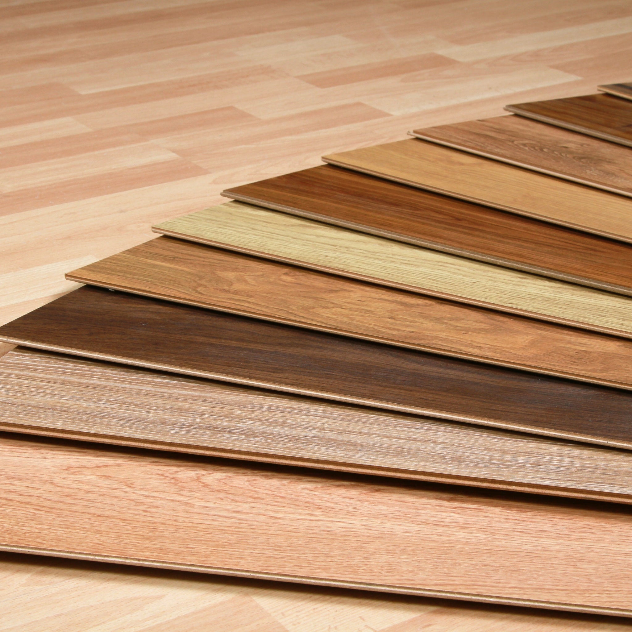 Close-up of 3-ply engineered oak flooring layers showing oak veneer, core, and backing structure