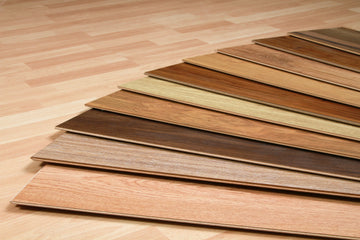 Close-up of 3-ply engineered oak flooring layers showing oak veneer, core, and backing structure